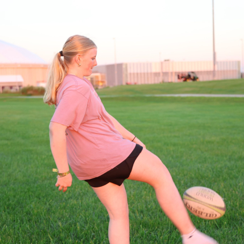 Student playing kickball 