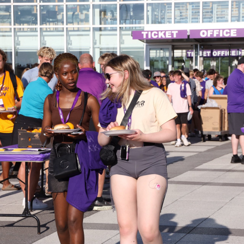 Students getting food at tailgate 