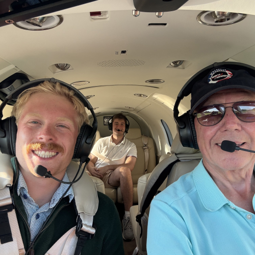 Lane takes a plane ride with host family. 