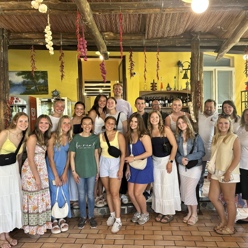 Group photo of students at a restaurant 
