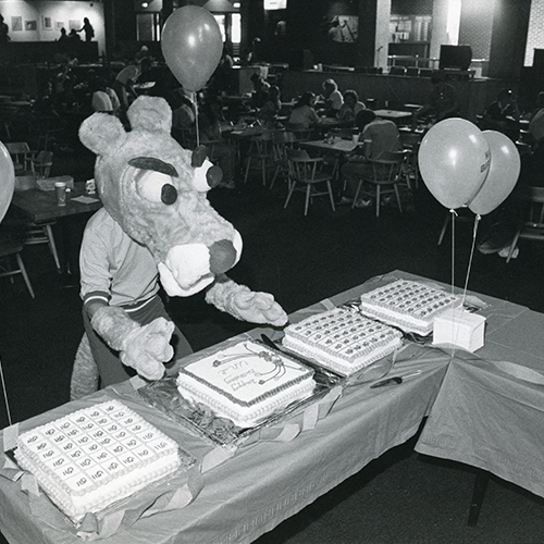 Mascot eating birthday cake