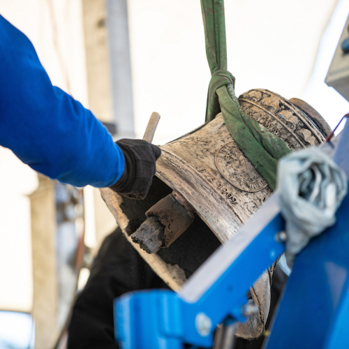 Verdin Company employee working on bell