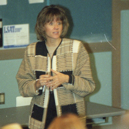 September 1999: Wilson teaching in a classroom.