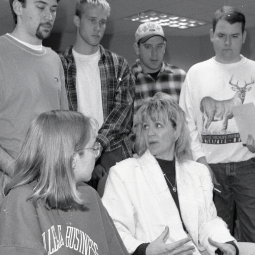 January 1998: Wilson speaking to students gathered at a computer.