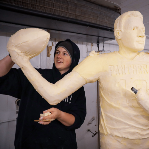 Grace Pratt working on the Kurt Warner sculpture. 