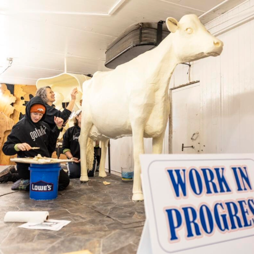 Grace and Sarah Pratt working on the butter cow. 