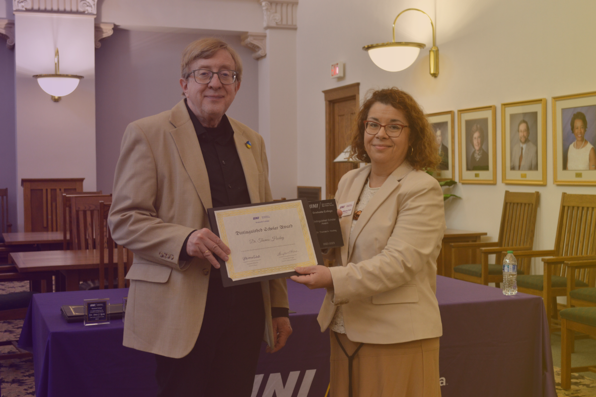 Dr. Olivares presenting Dr. Hockey with is award