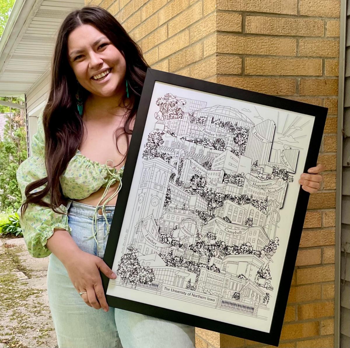 Amelia Gotera standing with her artwork of UNI campus