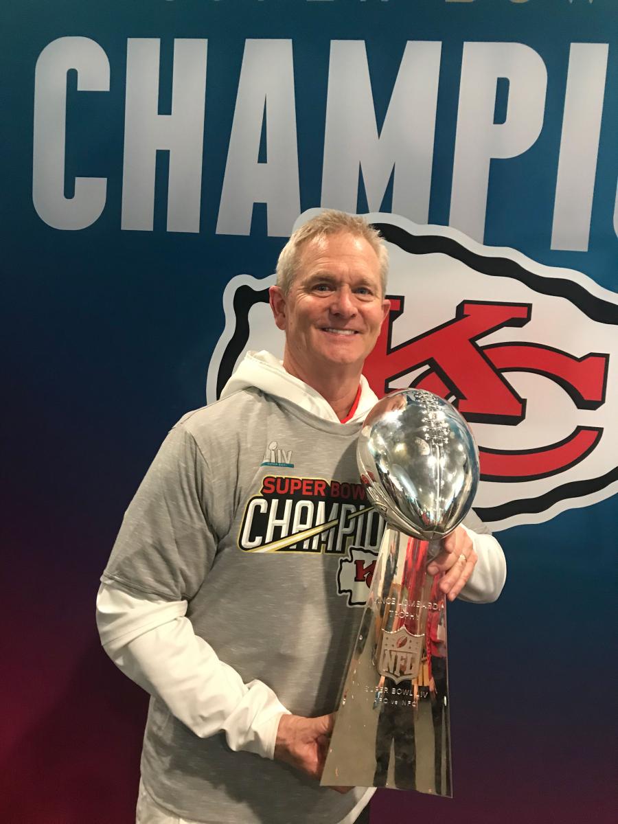 Mitch Holthus holding the Lombardi Trophy
