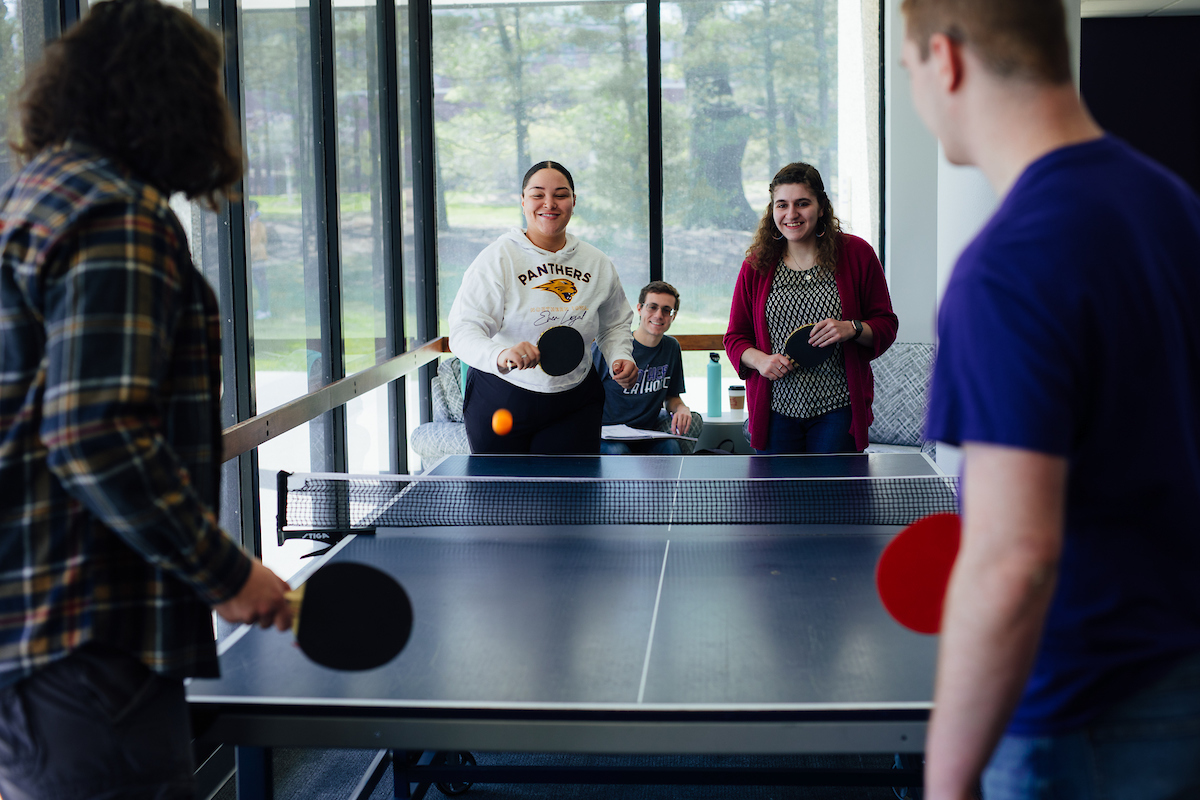 Students playing pingpong in residence hall
