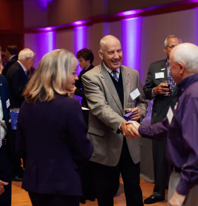 Bob Bowlsby shaking hands