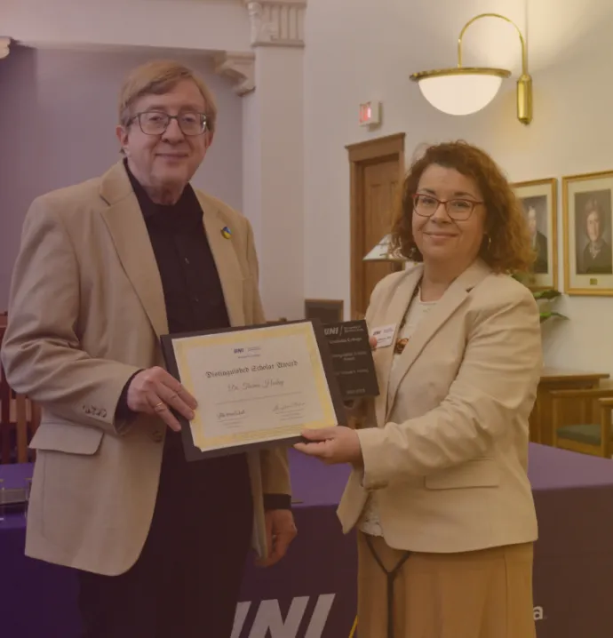 Dr. Olivares presenting Dr. Hockey with is award
