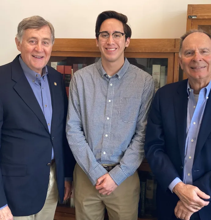 Gil Gutknecht and William Enyart with a UNI student