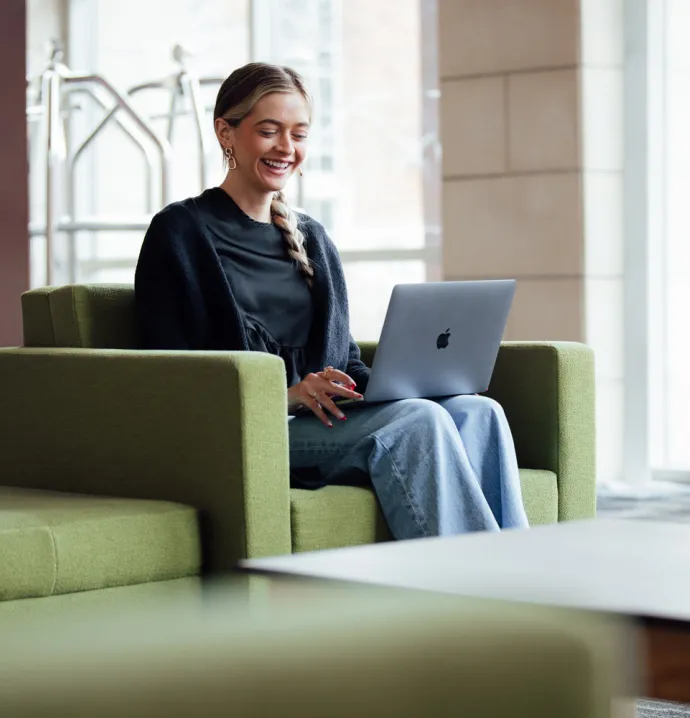 Student on a laptop on UNI campus