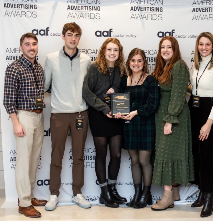 UNI advertising students with their ADDY award