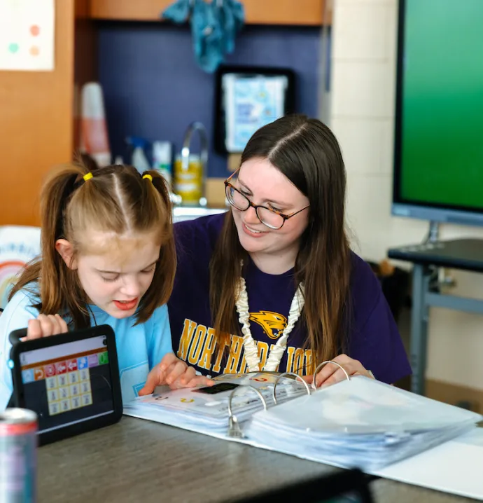 Student teacher working with special needs student