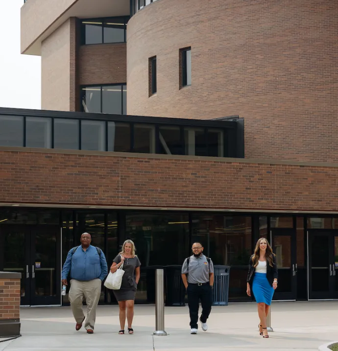Principalship students walking out of Schindler Education Center