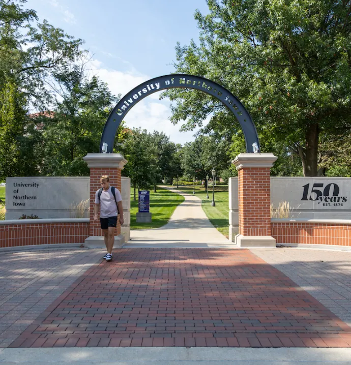 Student walking on UNI campus