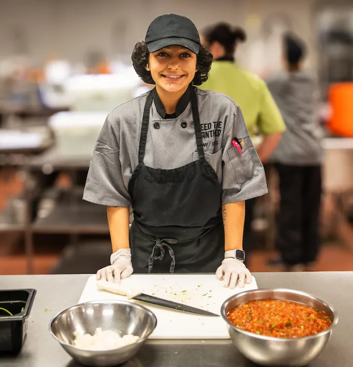 Isabella Carrillo making salsa on UNI campus