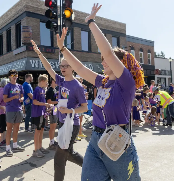 People in purple for UNI Homecoming Parade