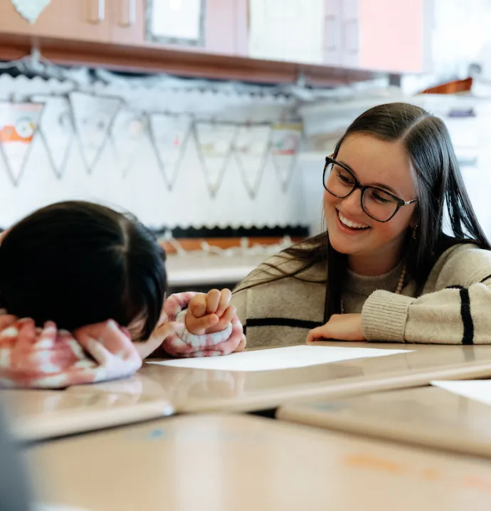 Student teacher working with student