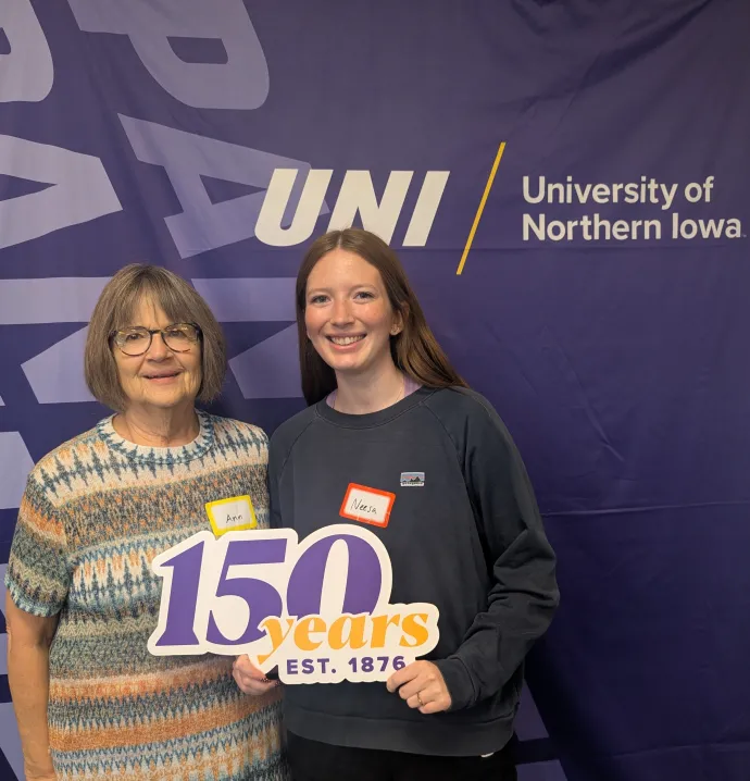 Neesa Striegel and Ann hold up 150 years sign