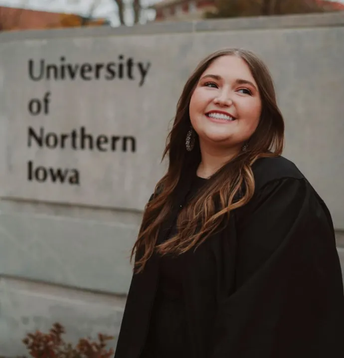 UNI student Averee Kasik pictured on capmus in front of a UNI sign