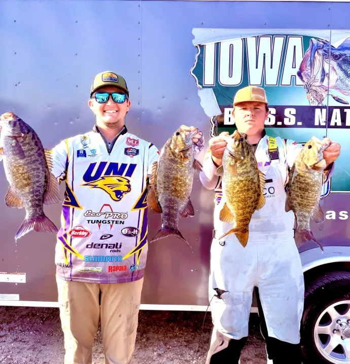 Cole Siebenahler and Jacob Lange holding up two fish each