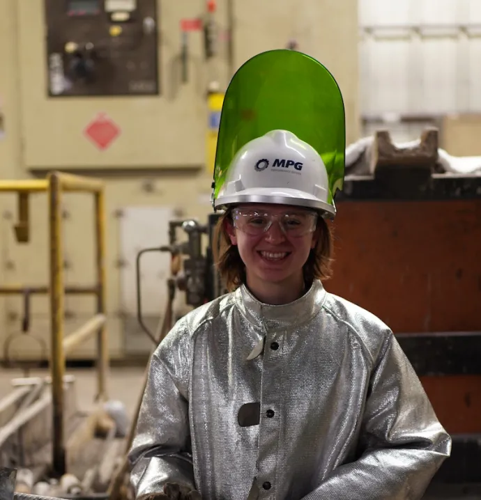 Student helping with pour in Metal Casting Center