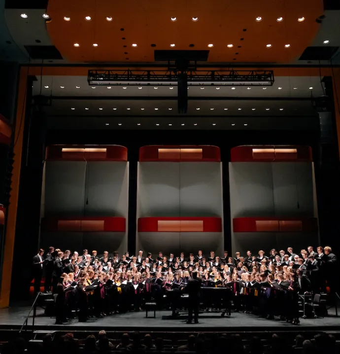 Choir performing in the Gallagher Bluedorn Great Hall