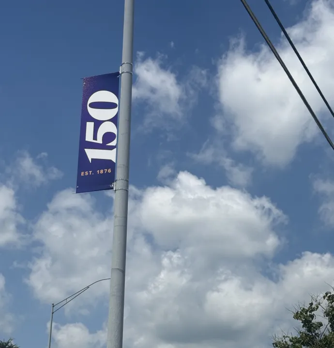 Purple 150 light-pole banner overlooking UNI-Dome