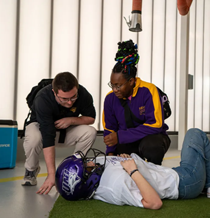 UNI athletic training students attending to a simulated patient. 