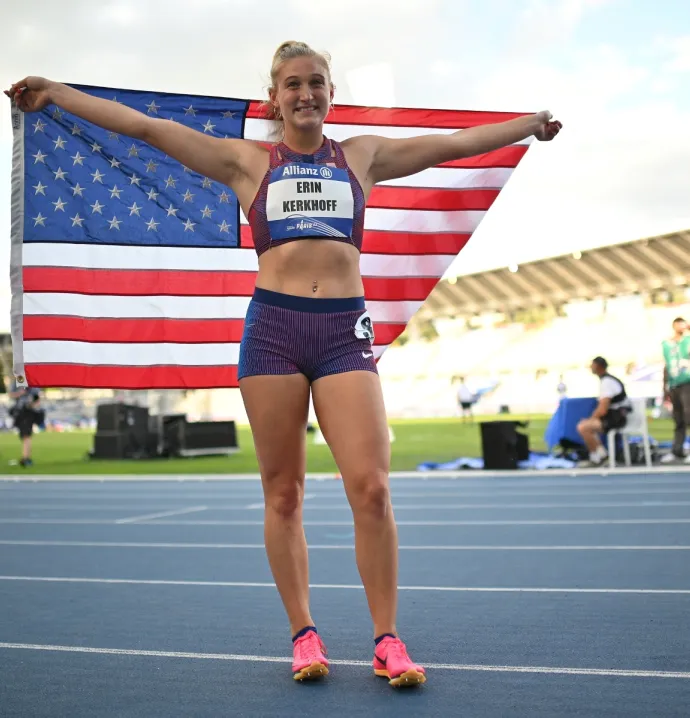 Erin Kerkhoff on race track with American flag