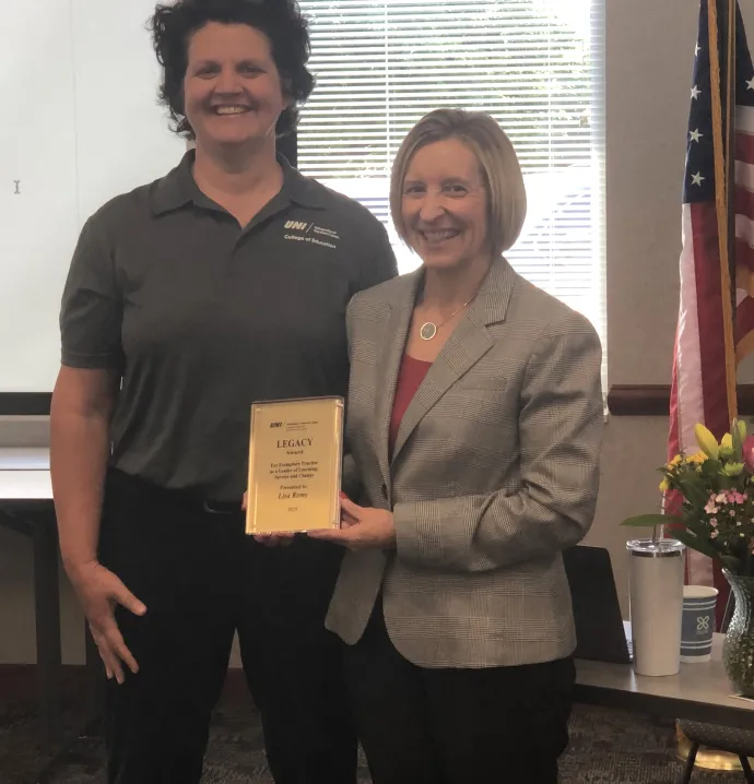 Lisa Remy receives Educational Leadership Legacy Award from Sharon Dentlinger