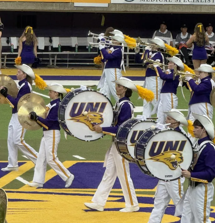 Tyler Schuur plays bass line in the Panther Marching Band.