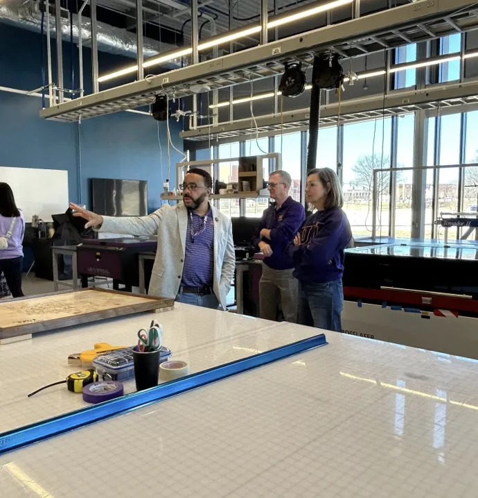 Governor Kim Reynolds looking around the Applied Engineering Building with Stewart Carter and President Nook