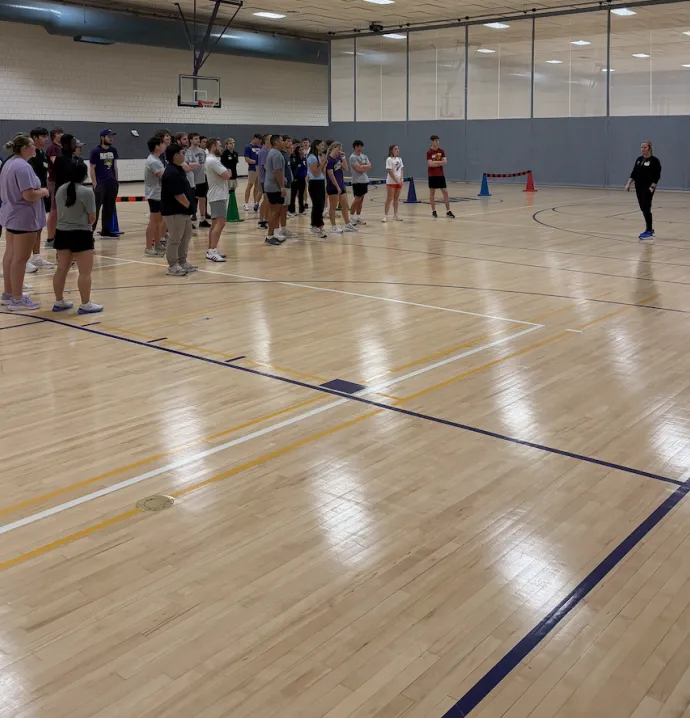 Students in a gym getting