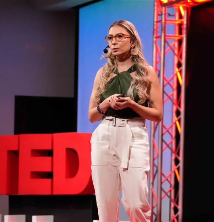 Speaker takes the stage at TEDx event