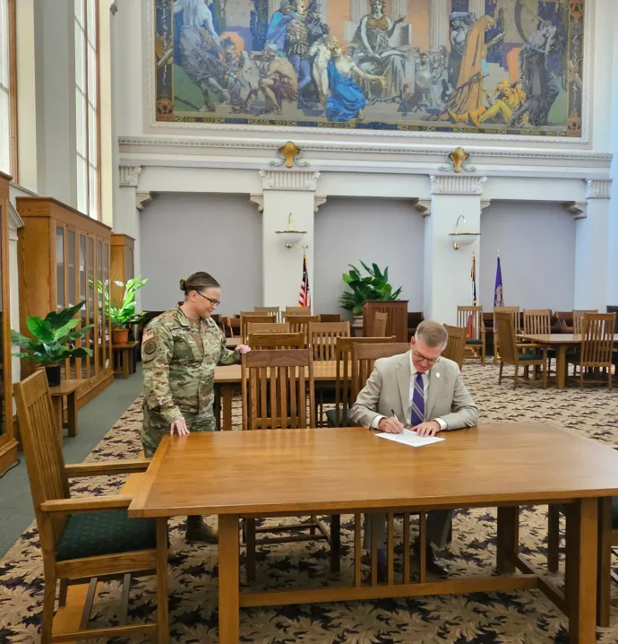 President Mark Nook signing memorandum of understanding regarding UNI ROTC