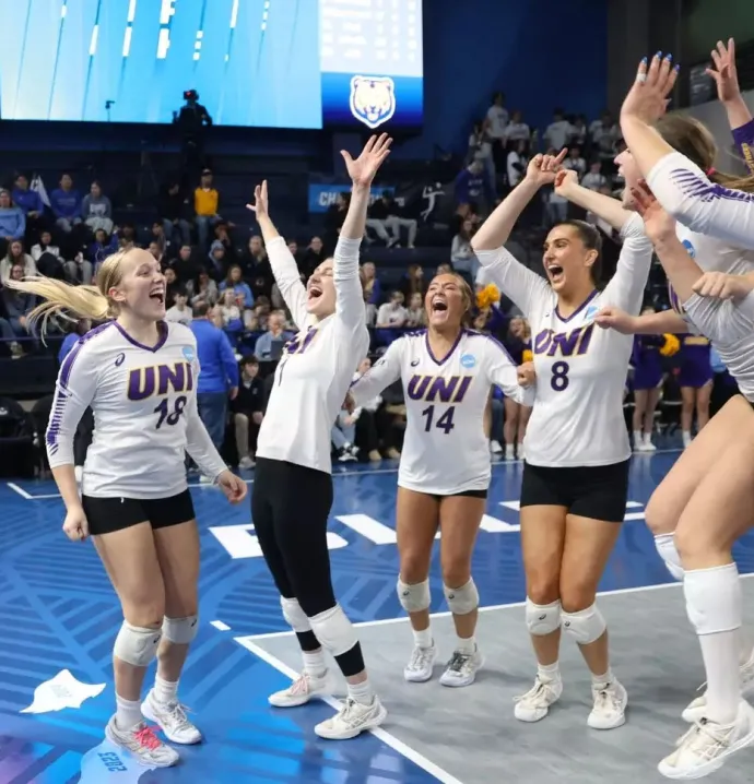 UNI volleyball celebrates their win over Utah