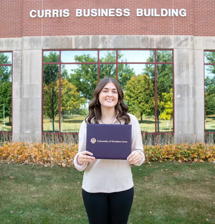 Jenna Meyer in front of Curris Business Building