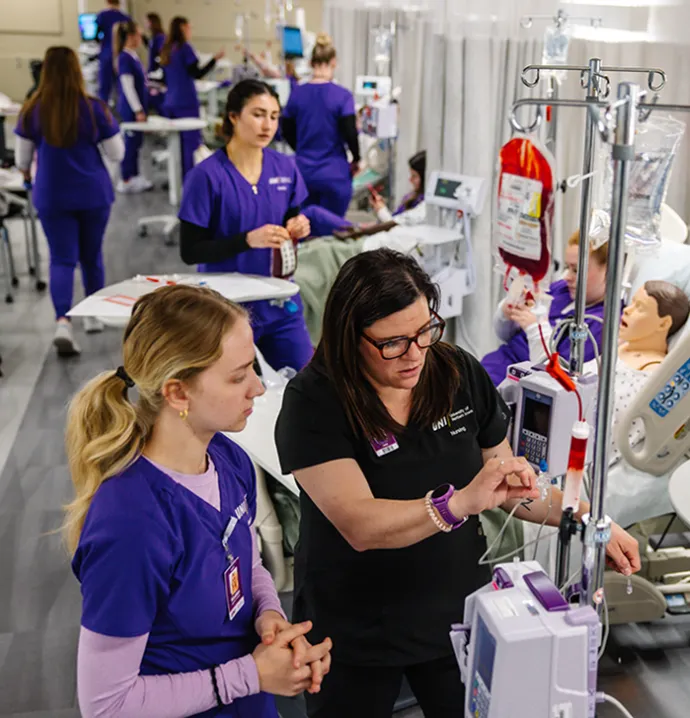 Students working in a model clinical setting. 