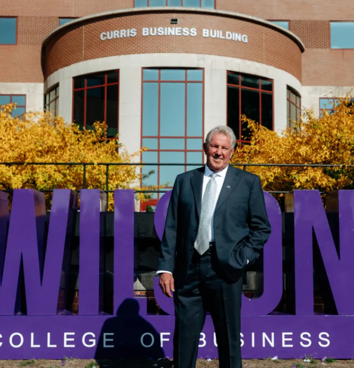 Photo of David Wilson in front of Curris Building. 