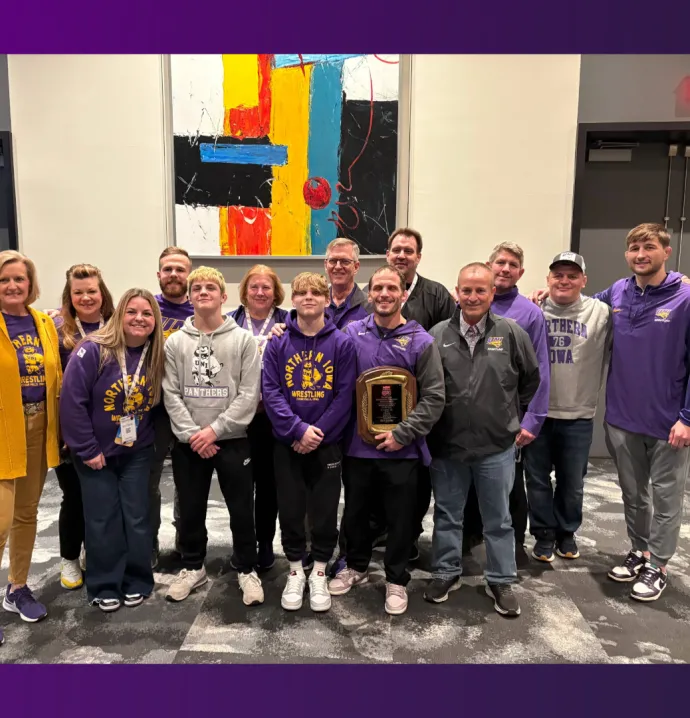 Coach Schwab poses with his family and UNI staff in Philadelphia