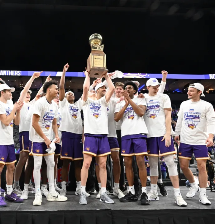 Panther men's basketball team lifting Arch Madness trophy