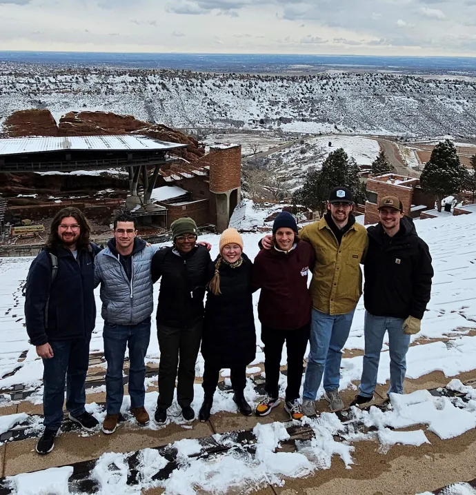 Seven UNI geography students in front of the Red Rock Ampitheater