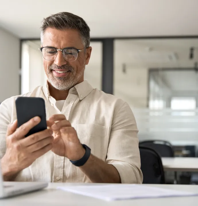 Middle-aged man looking at smartphone