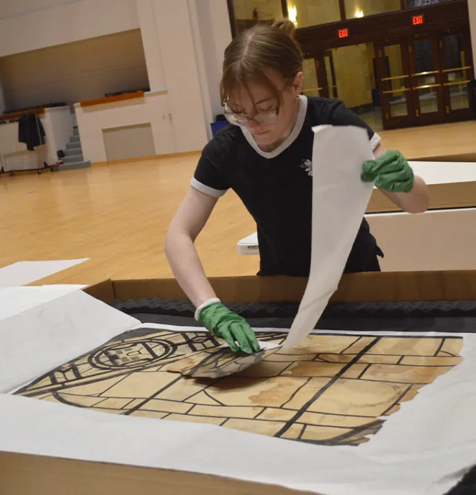 Anissa working on a fragment of Grant Woods' drawing 