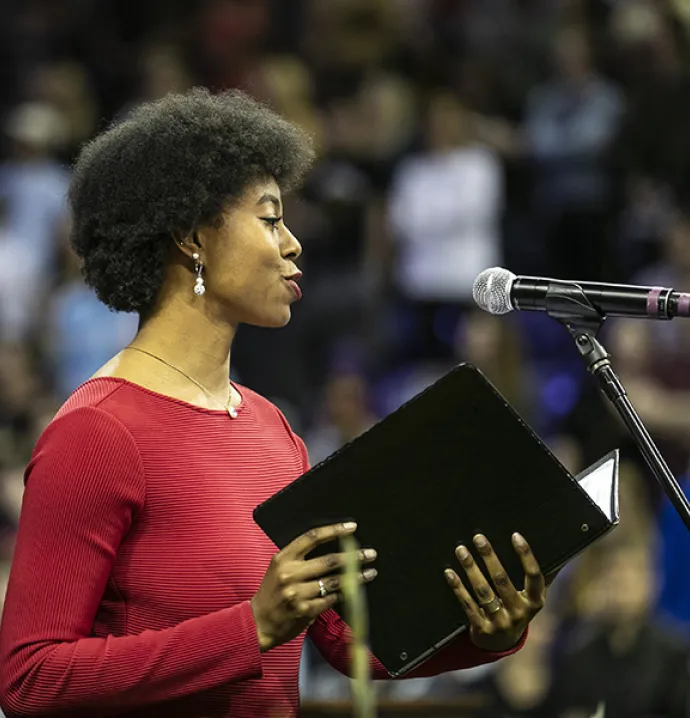 UNI graduate student Athena-Sade Whiteside sings at commencement.