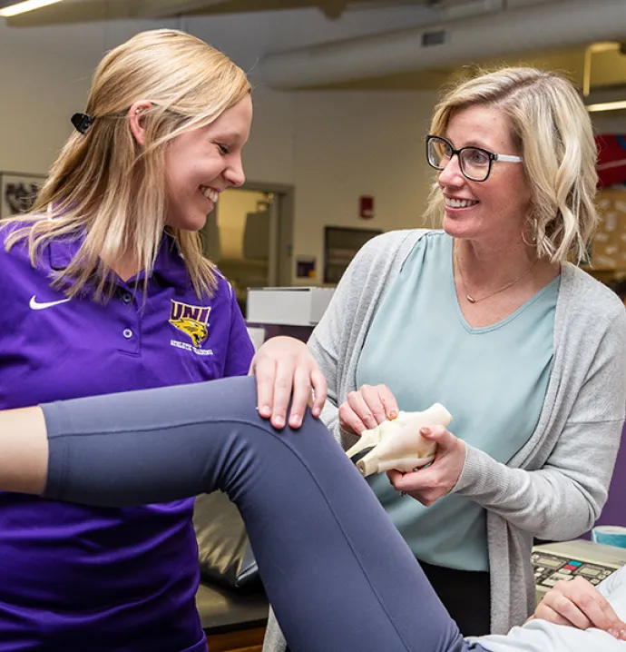 UNI graduate student Paige Mathews works in the athletic training area in the Human Performance Center.
